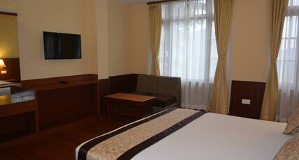 Juniper Residency Room Type - DELUXE FAMILY ROOM TRIPLE BED