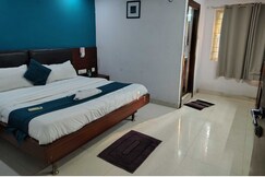 Rooms of Hotel O Karthikeya Pride