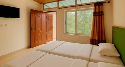 Snow View Tourist Resorts Room Type - Deluxe double bed sharing Room