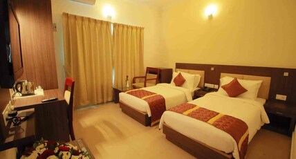 Amruthu Residency Koothattukulam Room Type - Deluxe AC Room