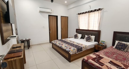 HOTEL RAJ HANS Room Type - Deluxe Triple Room ( 1 Double Bed + 1 Single Bed ) HOTEL RAJ HANS Room Type - Deluxe Triple Room ( 1 Double Bed + 1 Single Bed )