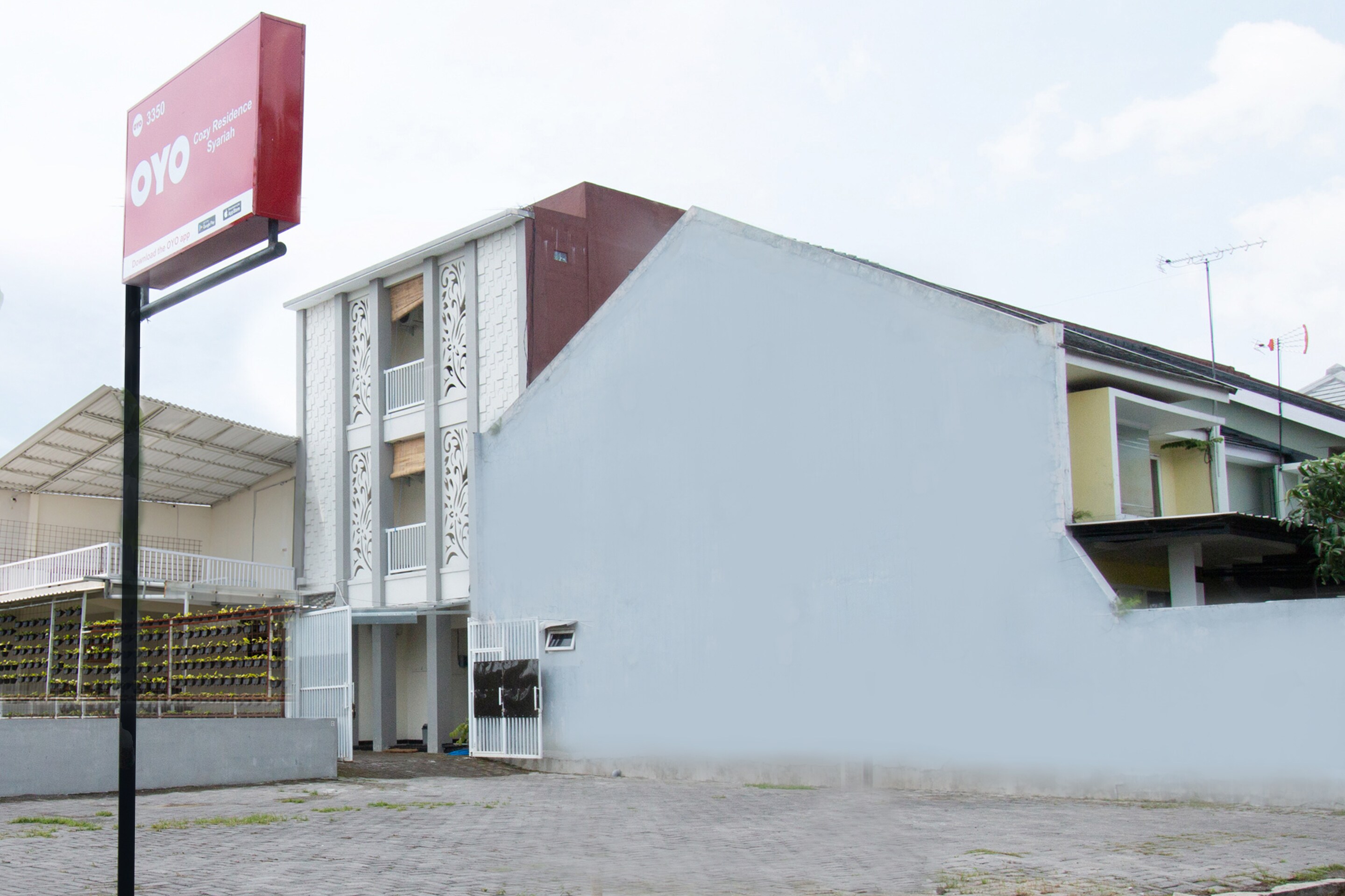 Hotel O Cozy Residence Syariah - Tap to explore photos