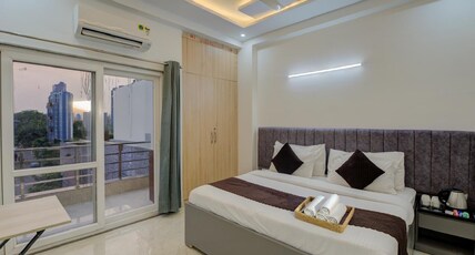 Hotel Aura Homes Near Artemis Hospital Room Type - Deluxe Queen Bed Room with City View Hotel Aura Homes Near Artemis Hospital Room Type - Deluxe Queen Bed Room with City View