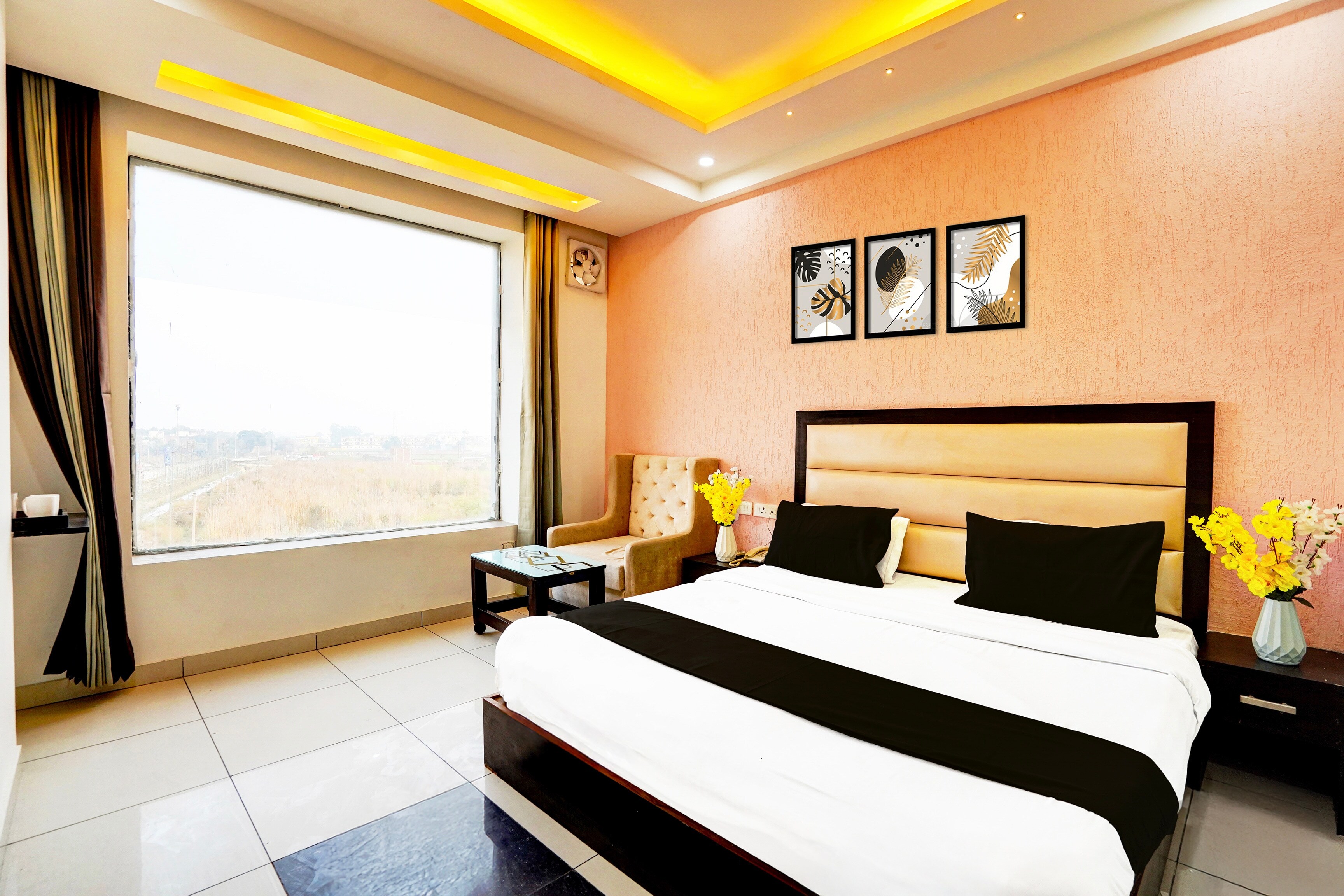 Collection O Surya Enclave Formerly Aroma Regency - Tap to explore photos