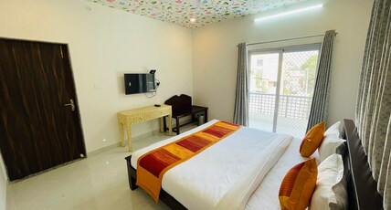 Krishna Kottage Room Type - Deluxe Room with balcony view