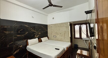 BSS Residency Courtallam Room Type - Luxury Room with Garden View