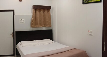 BVR DAZZLE RESIDENCY Room Type - Deluxe AC Room