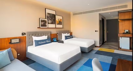 The WB Abu Dhabi, Curio Collection by Hilton - Free Theme Park Tickets Room Type - Two Double Beds Artist Room with Pool View With Theme Park Access The WB Abu Dhabi, Curio Collection by Hilton - Free Theme Park Tickets Room Type - Two Double Beds Artist Room with Pool View With Theme Park Access