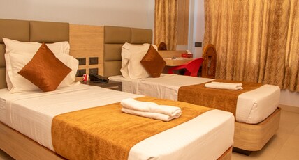 Hotel Om International Room Type - Deluxe AC Twin Bed