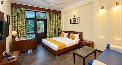 Naturoville Wellness Resort Rishikesh- Surrounded by Nature, Rooted in Wellness Room Type - Deluxe Room with Garden view Balcony Naturoville Wellness Resort Rishikesh- Surrounded by Nature, Rooted in Wellness Room Type - Deluxe Room with Garden view Balcony