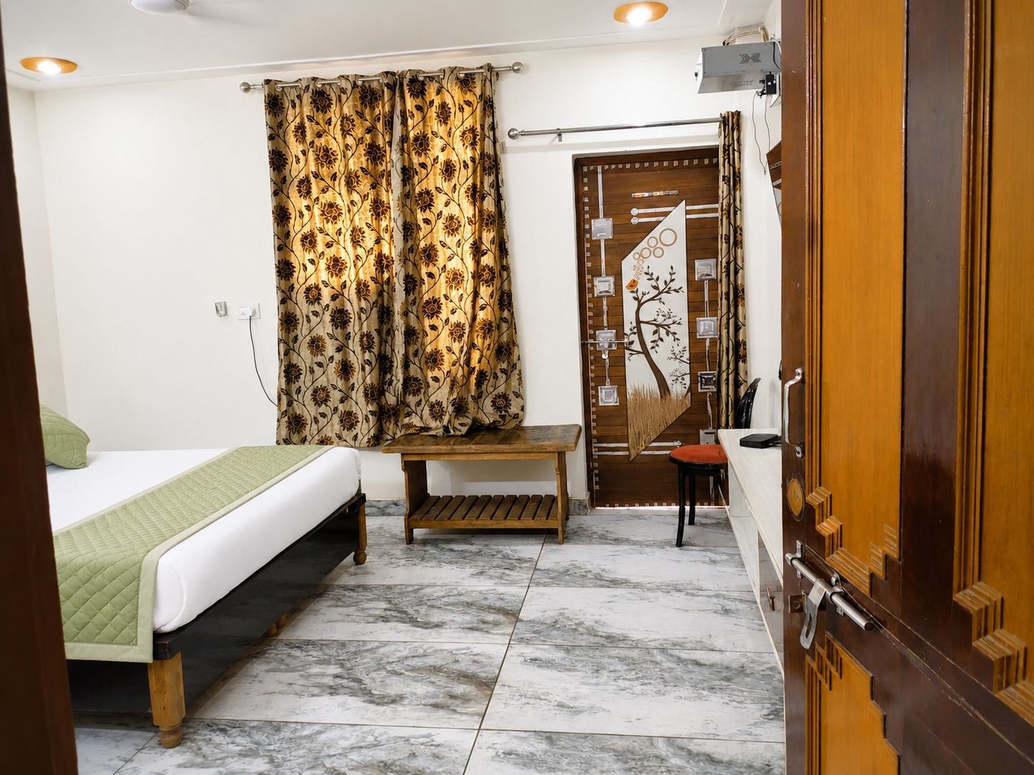 radhika comfort stay - Tap to explore photos