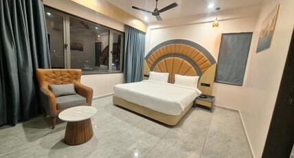 White Panda Hotels SHREE RADHE DWARKA Room Type - Deluxe Double Bed Temple and Sea View