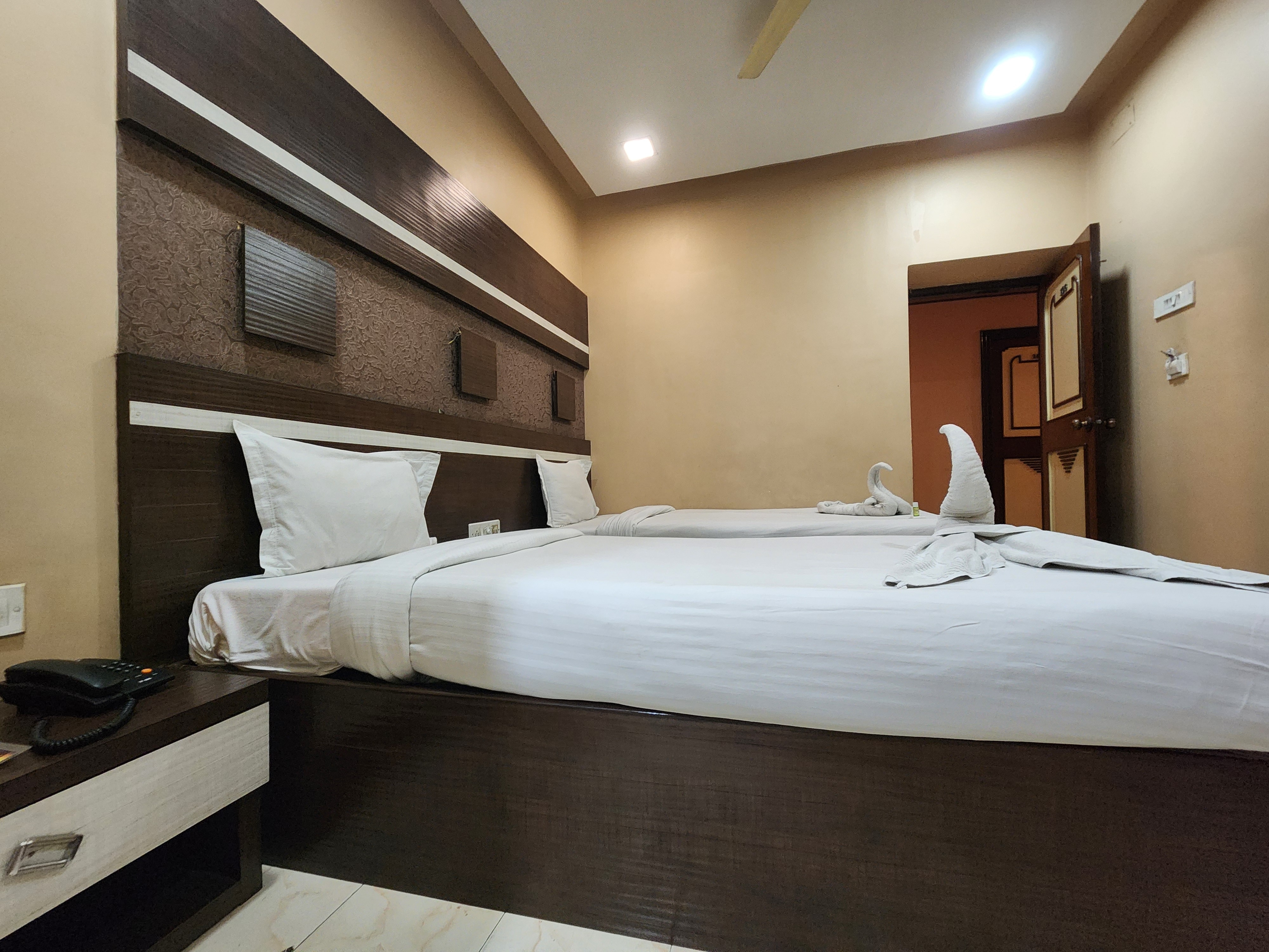 Hotel Pushpak International - Tap to explore photos