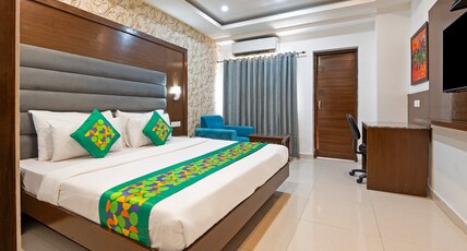 Treebo Premium Grand Legacy Elite with Roof Top Cafe Room Type - Deluxe Room