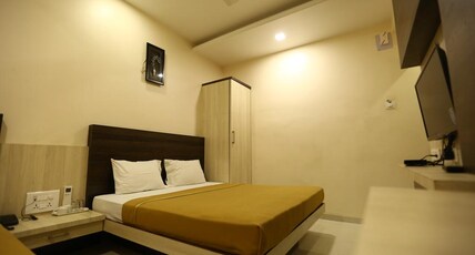 Hotel Madhuri Executive( 3 Minutes Walk to Mahalaxmi Temple ) Room Type - Triple Bed  AC
