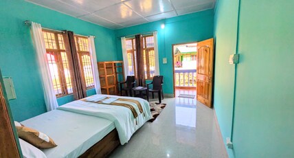 Accomoon River Side Cottages Room Type - Double bed deluxe room with hills / balcony