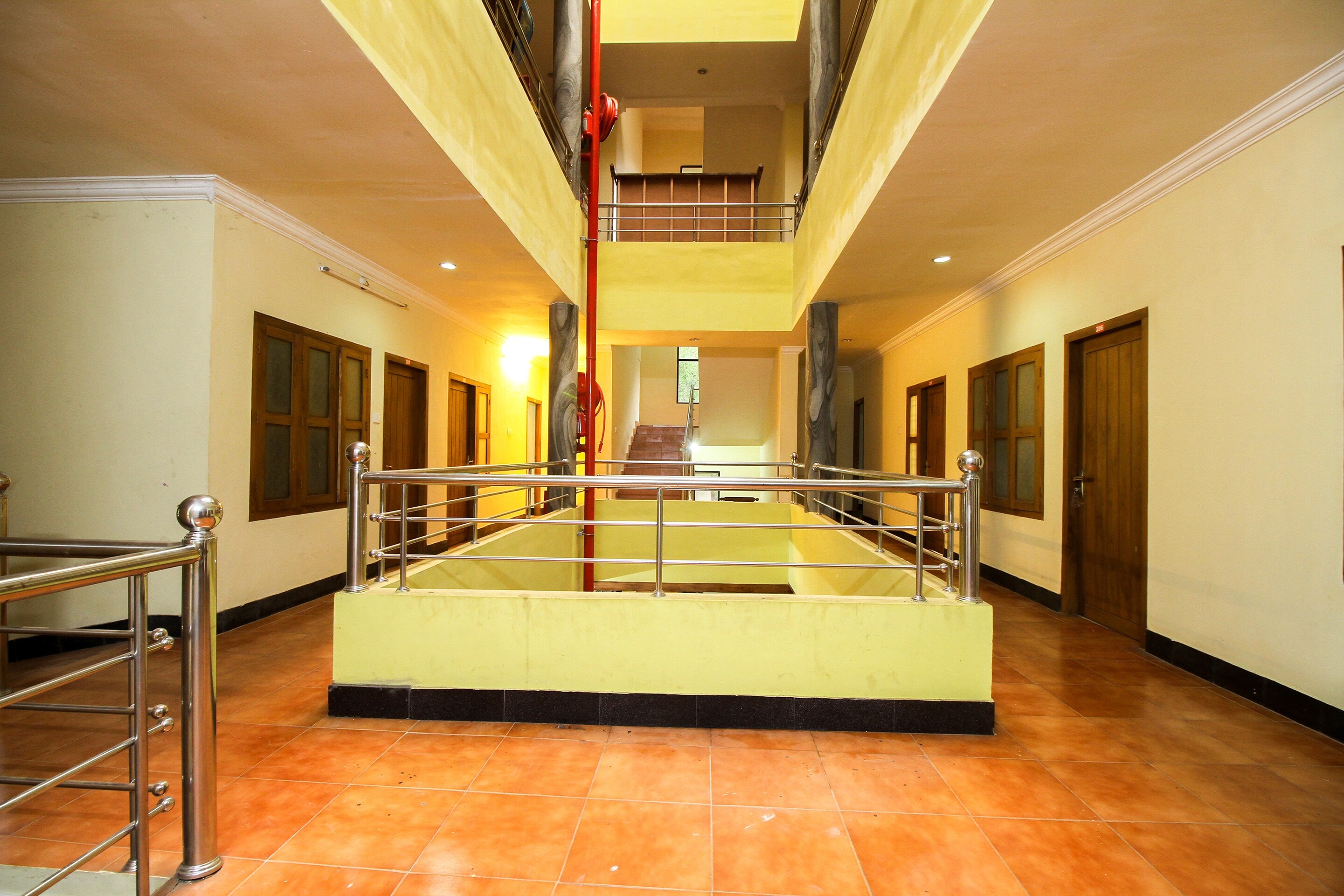 SPOT ON Mukkam Tourist Home - Tap to explore photos