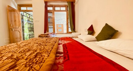 Madpackers Manali | Backpacking Hostel with Mountain View Room Type - Deluxe  Triple  room Ensuite