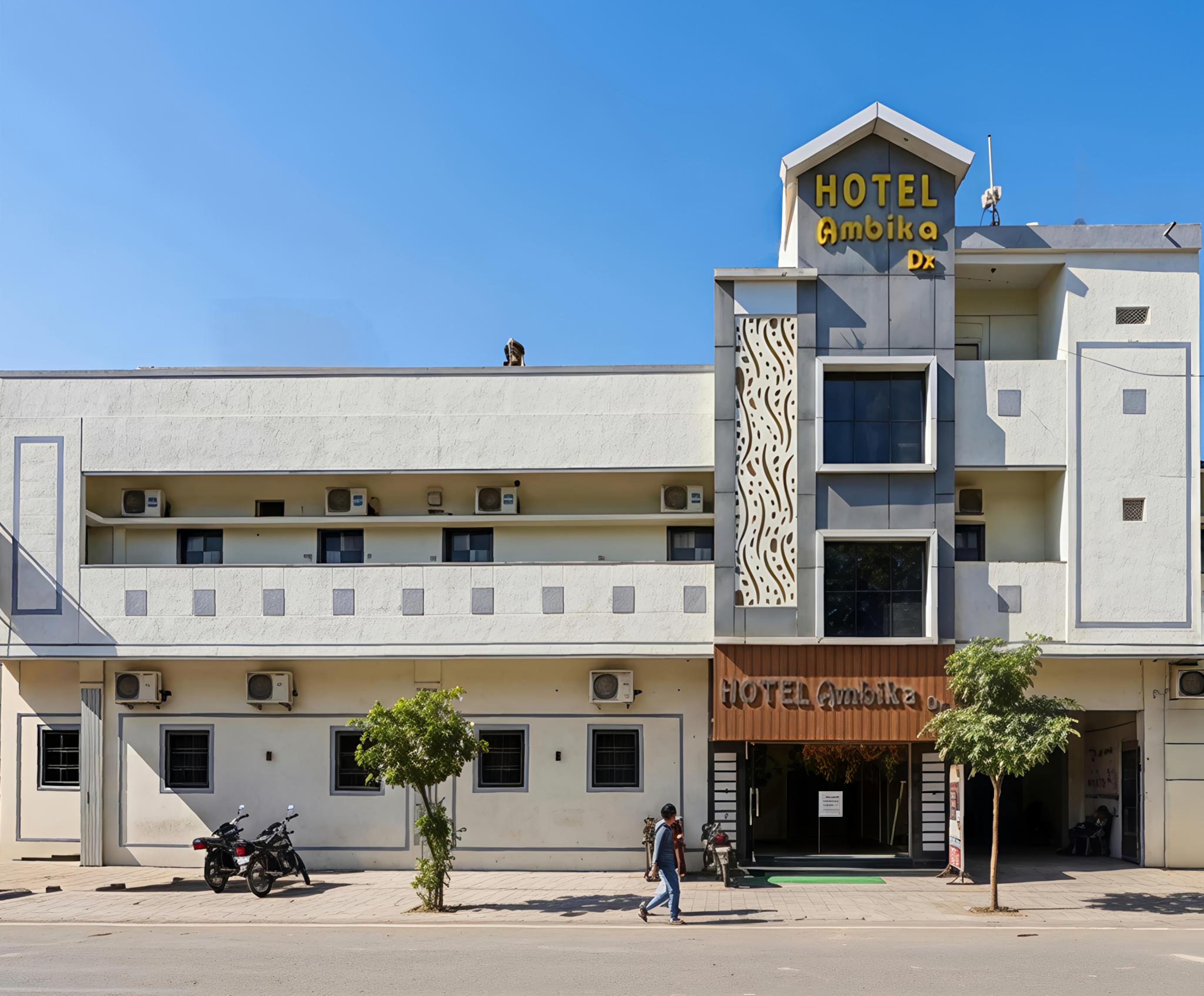HOTEL AMBIKA DX - Tap to explore photos