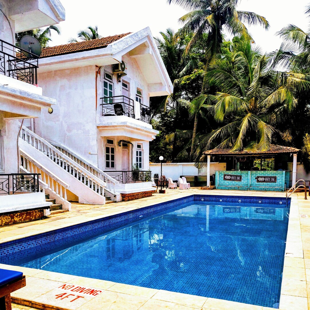 Goan Fiesta Service Apartments | Rooms & Pool - Tap to explore photos