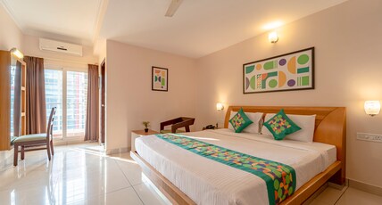 Treebo Akshaya Palace Inn Room Type - Deluxe Family Room