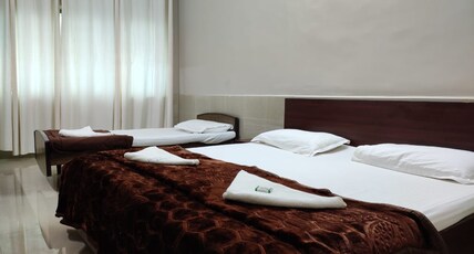 Hotel Sugam Room Type - Deluxe Triple Bed AC