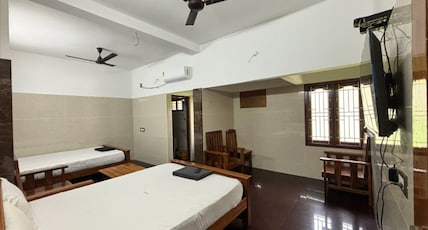 BSS Residency Courtallam Room Type - 1 Bedroom Family Room with Garden View BSS Residency Courtallam Room Type - 1 Bedroom Family Room with Garden View
