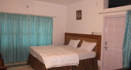 Vikramgarh Lakeview at Fatehsagar| Infinity Pool and Sitout  Room Type - Deluxe Room with Balcony and Huge Bathroom