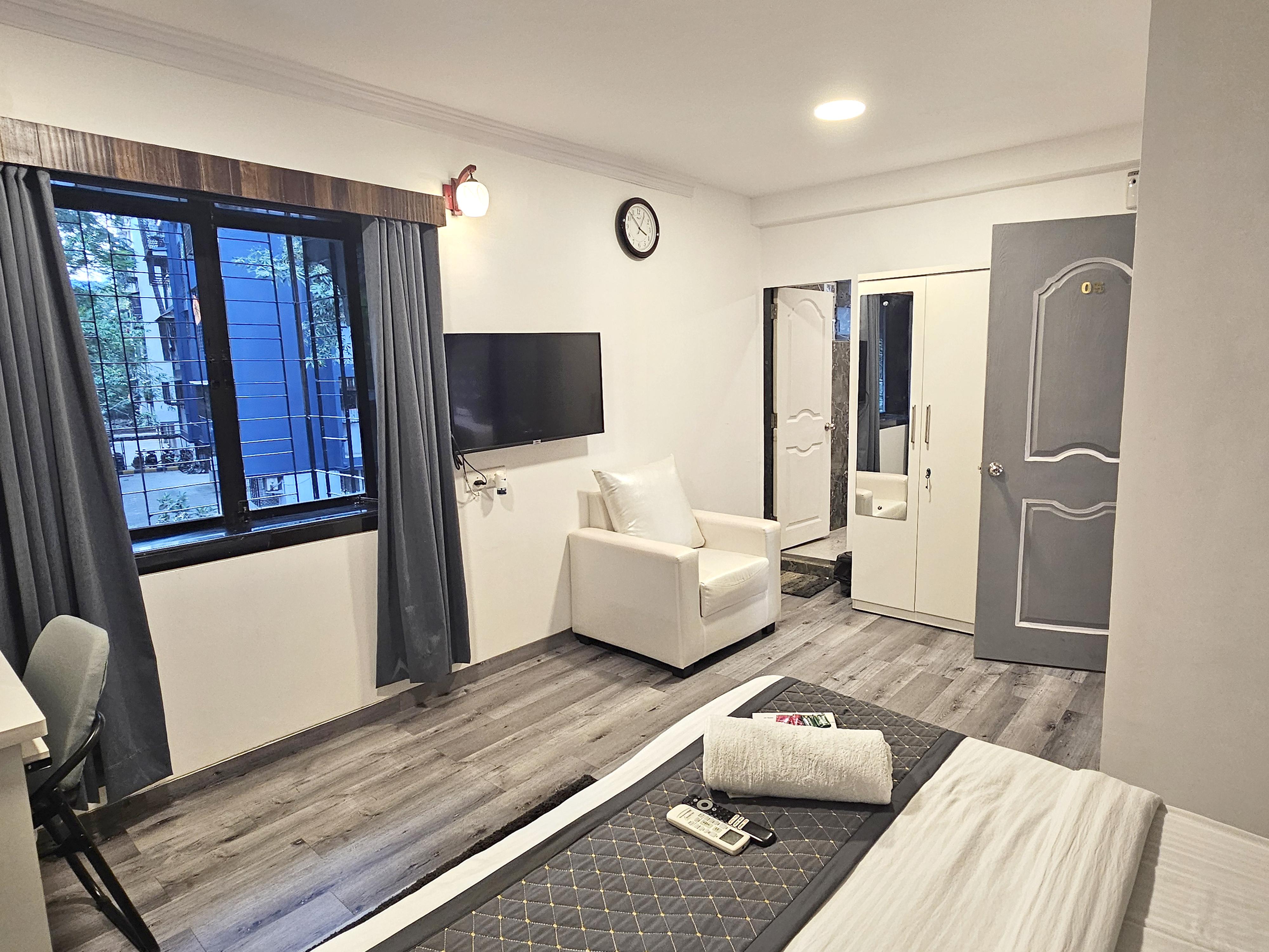 Astha Kandivli Service Apartment - Tap to explore photos