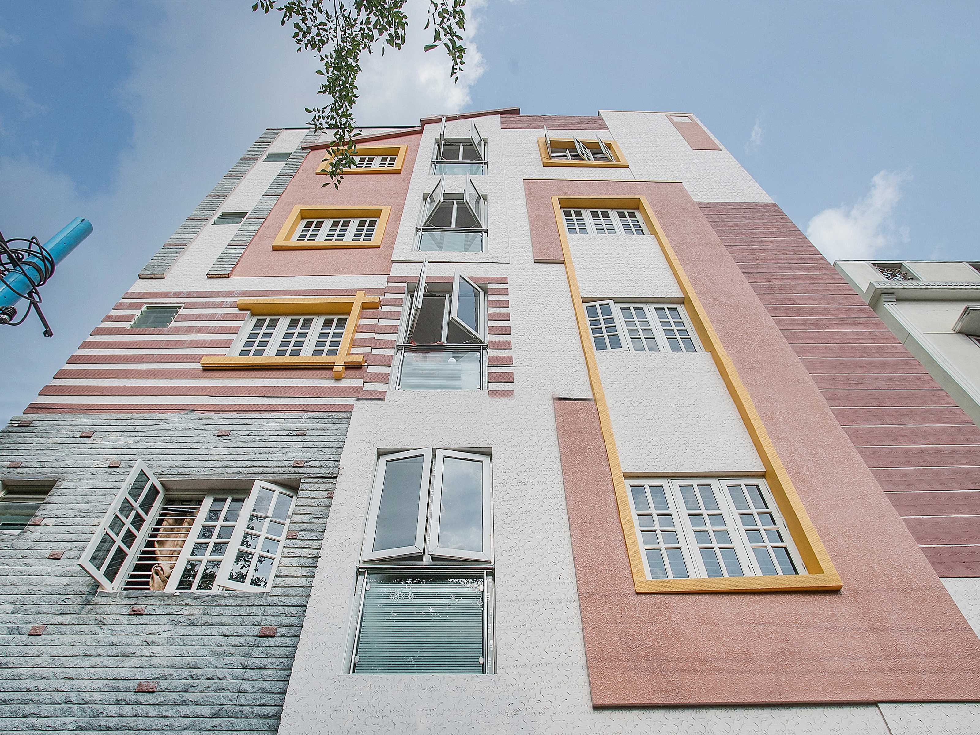 Hotel O NR Suites - Tap to explore photos