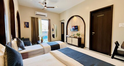 Omkareshwar Jyotirling Inn Room Type - Deluxe Triple Room