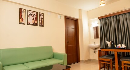 J K Grand Apartment Hotel Room Type - Deluxe Room