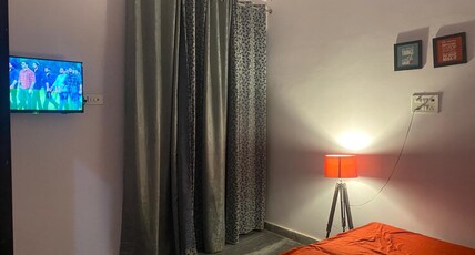 Drippy Hotel and Cafe Marutikunj Room Type - Premium room