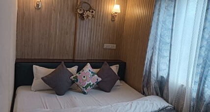 Maithili Divine Stay Room Type - Bedroom 108 Deluxe double bed view