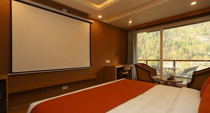Udit Regency by west western kasol ( Central Heated and Air Cooled ) Room Type - Superior Room with Balcony River View - (Home Theater)