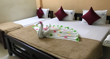 LAXMI VENKATESWARA HOTEL Room Type - Mini Family Room-One King and One Single Bed