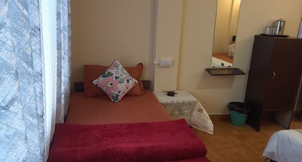 Maithili Divine Stay Room Type - Bedroom 105 double bed view side deluxe 