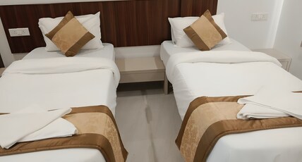 Westbay Biz Dreams Hotel & Suites Room Type - AC Deluxe Room with 04 Single beds