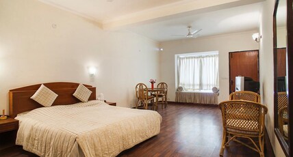 Woodsvilla Residency Room Type - Deluxe Room