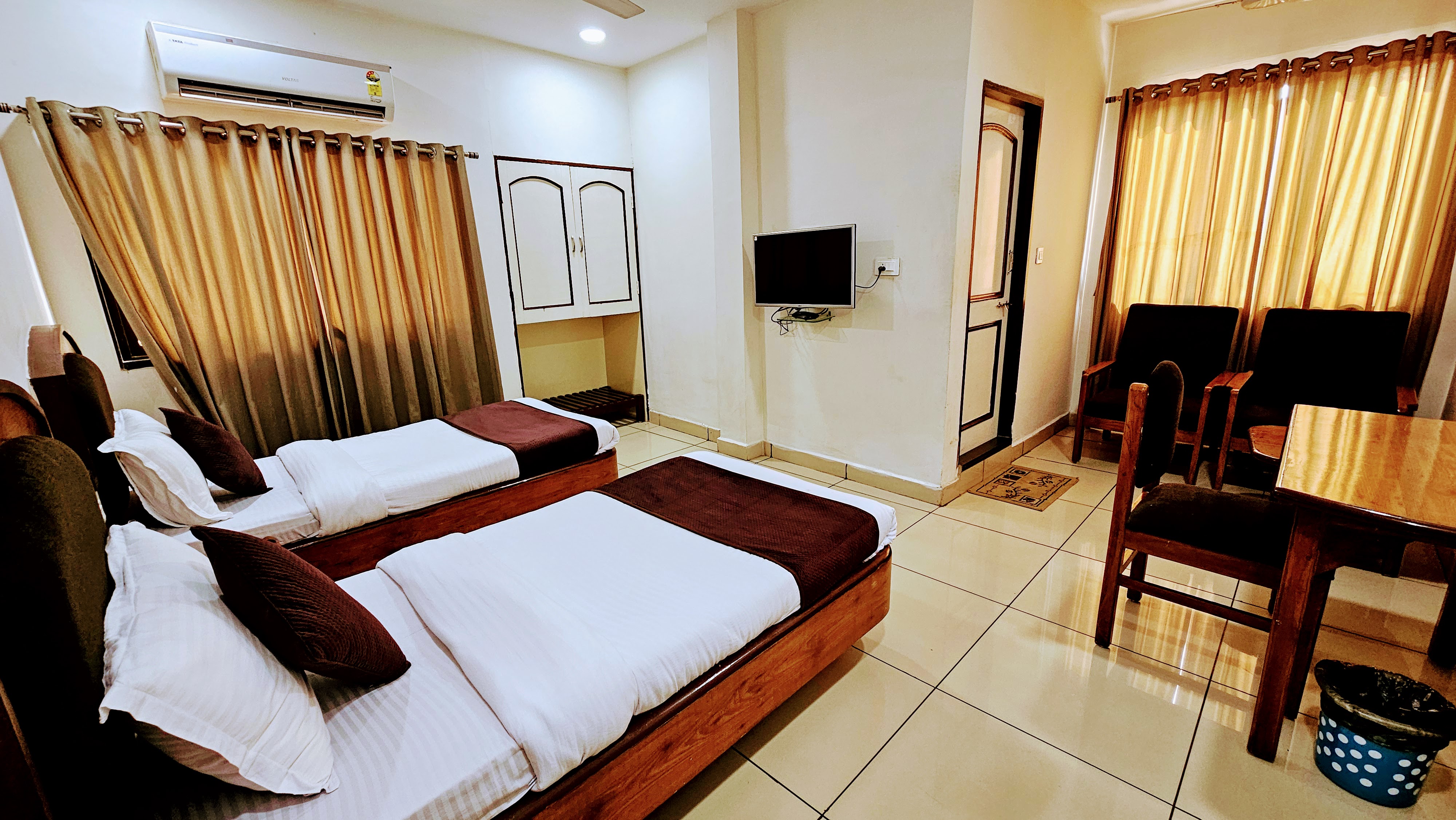 HOTEL TIRTH - Tap to explore photos