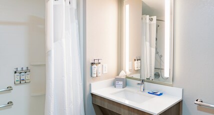 Holiday Inn Express Hotel & Suites Raleigh SW NC State Room Type - 2 Queen Suite Communication Mobility Accessible Tub Holiday Inn Express Hotel & Suites Raleigh SW NC State Room Type - 2 Queen Suite Communication Mobility Accessible Tub