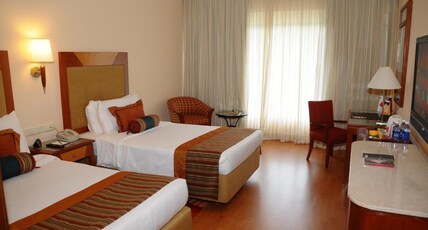 The Lalit Ashok Bangalore Room Type - Executive Club Twin Bed Room, Sitout, Pool view  facing