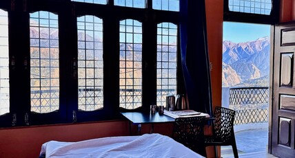 SamathaStay Room Type - Bedroom 1 with private balcony and mountain view