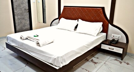 HOTEL SHUBHARAMBH Room Type - Deluxe Room