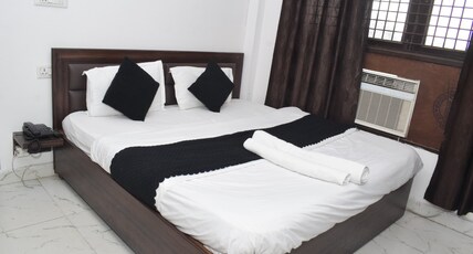 Om Pushp Residency Room Type - deluxe room AC
