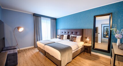 Holiday Inn LUBECK Room Type - 2 Single Bed Suite with Sofa Bed