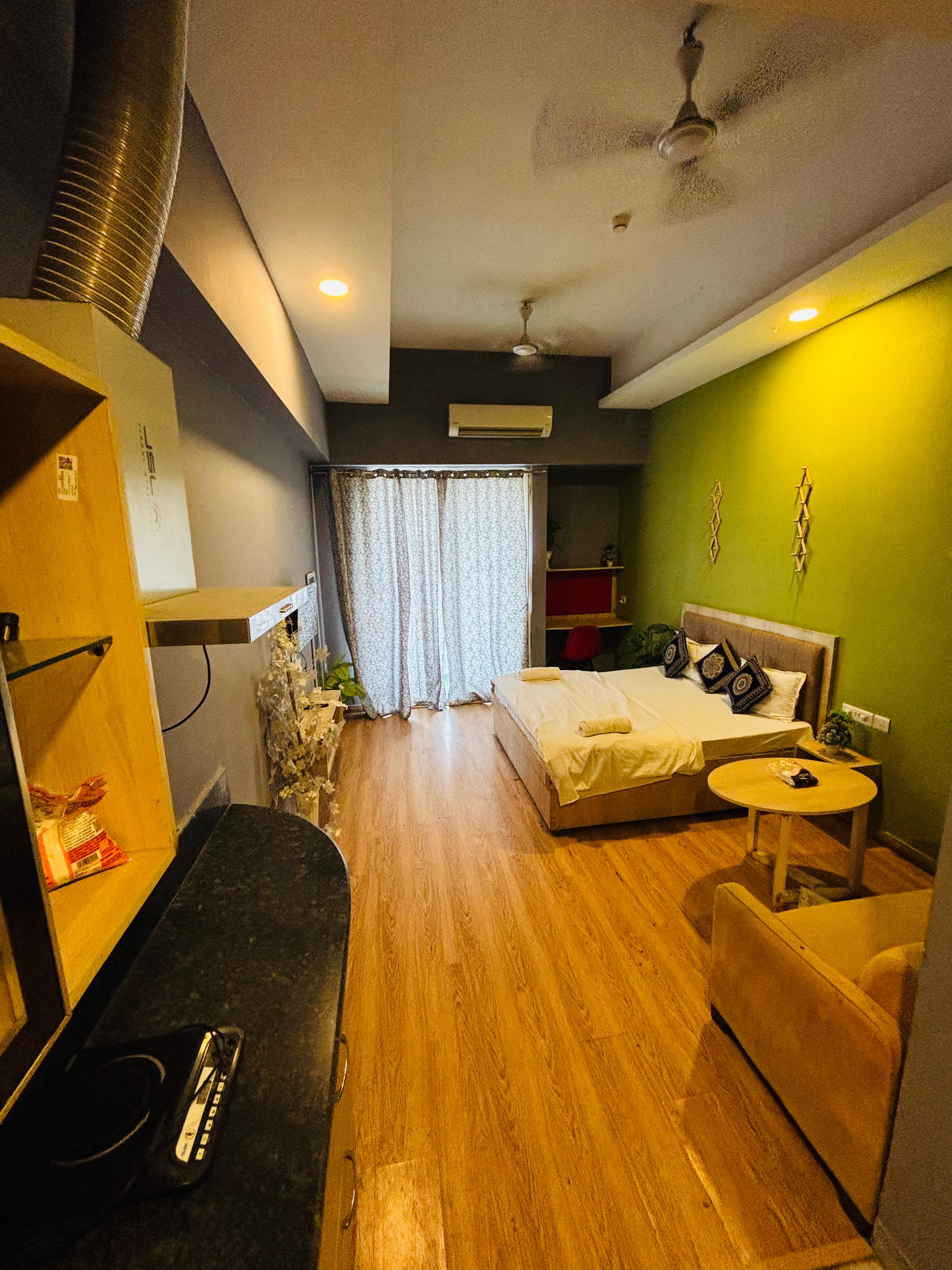 The Forest stays | studio apt at gaur City mall - Tap to explore photos