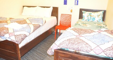 Ayodhya Guest House Room Type - Deluxe Triple Room