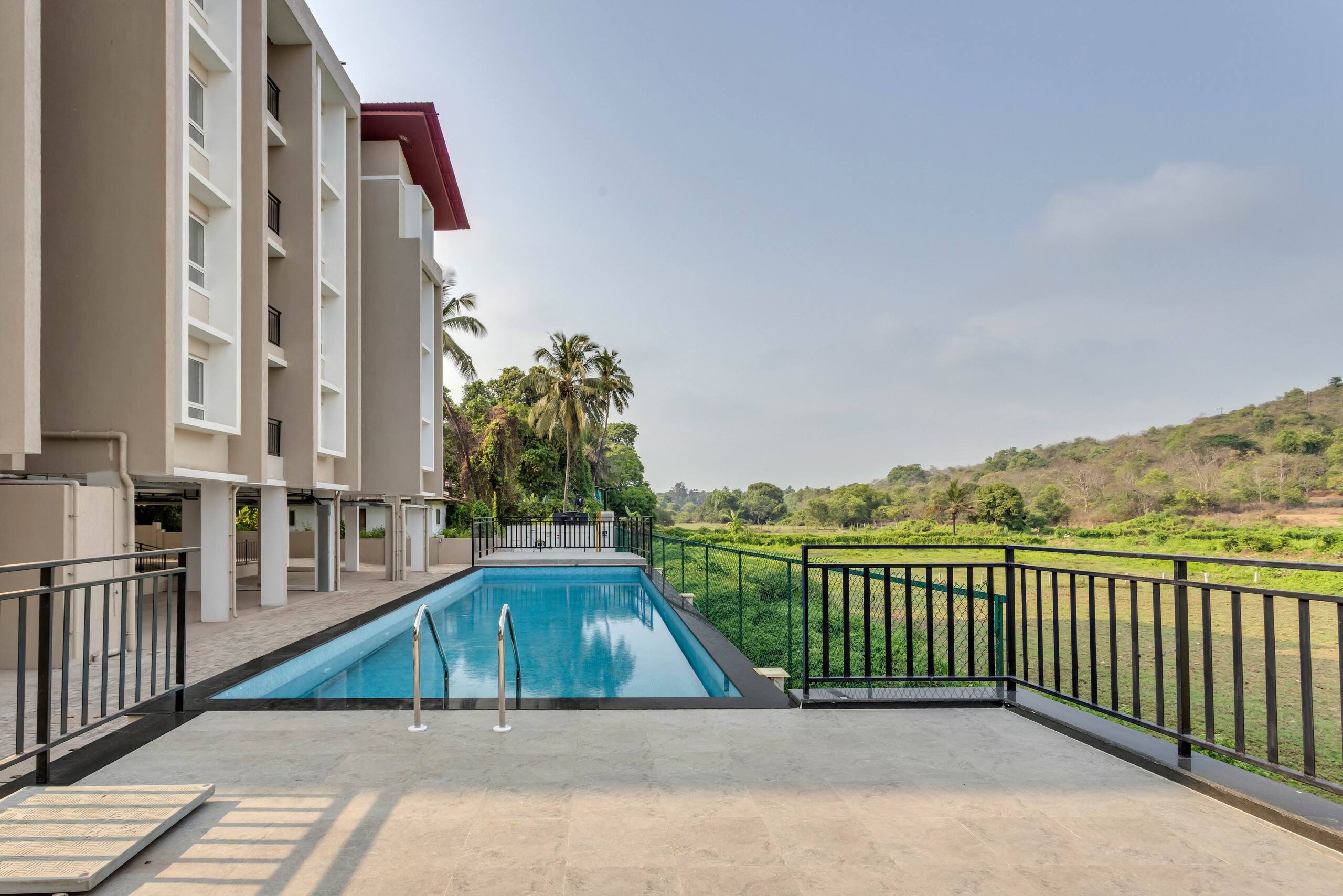 2BHK with Pool nr Candolim Beach | Palms By Umiya | Hireavilla - Tap to explore photos