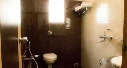 HOTEL SURYA (Pure Veg) Room Type - ROYAL DELUXE ( 4 Person)